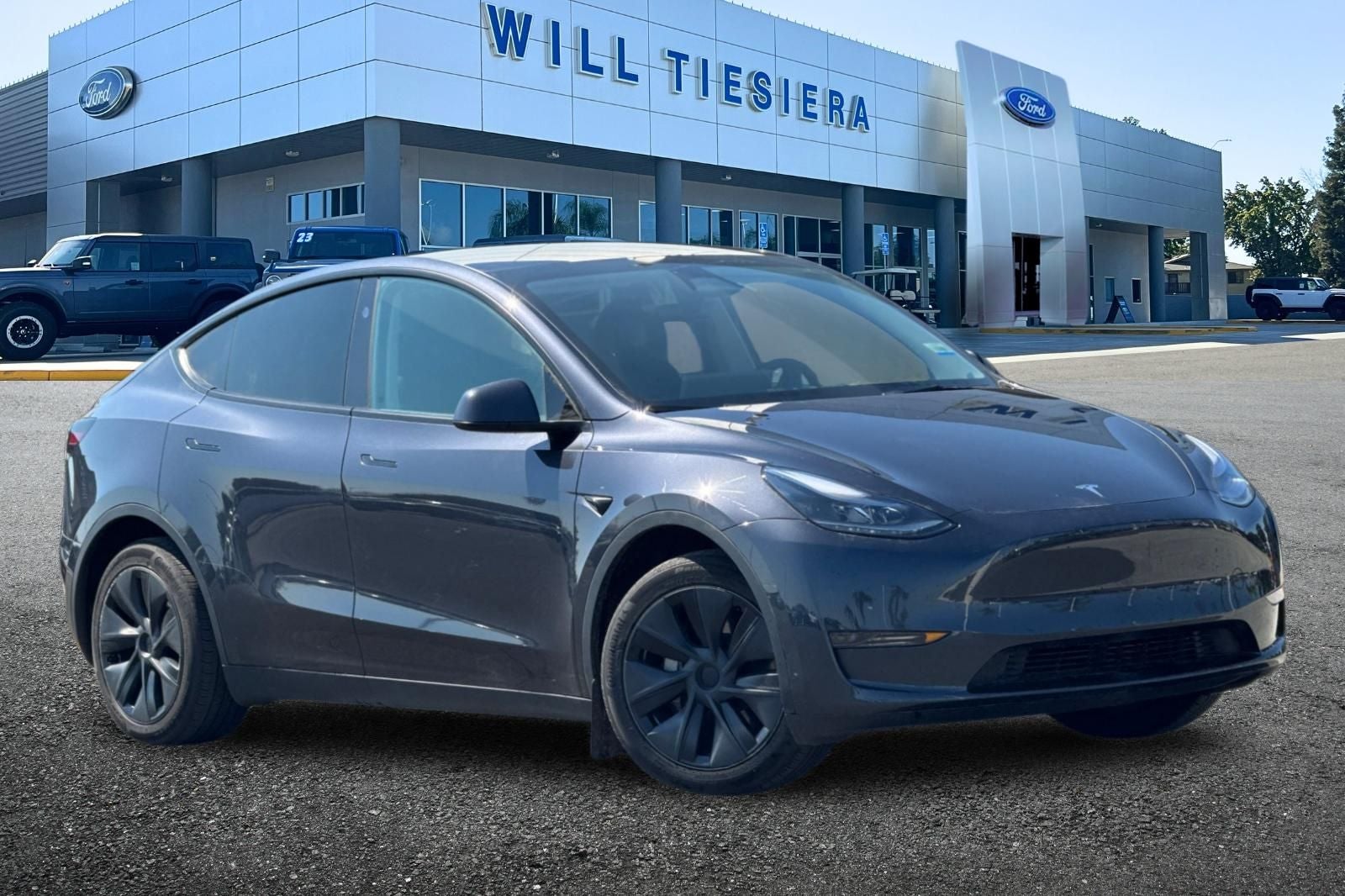 Used 2024 Tesla Model Y Long Range with VIN 7SAYGDEDXRF103199 for sale in Tulare, CA